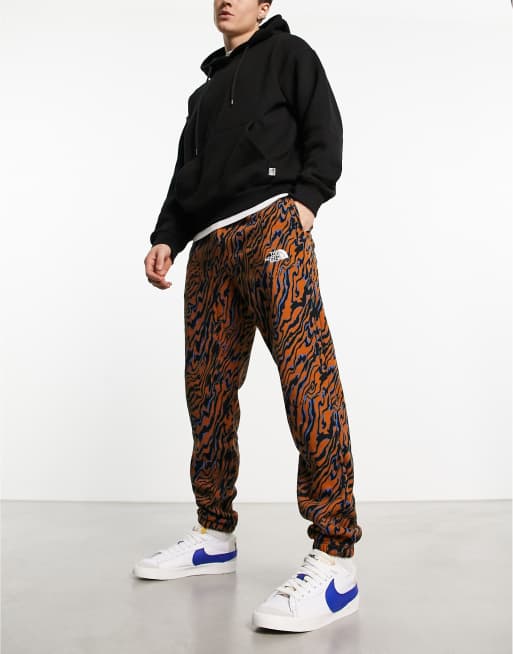 The North Face Essential oversized joggers in brown marble print