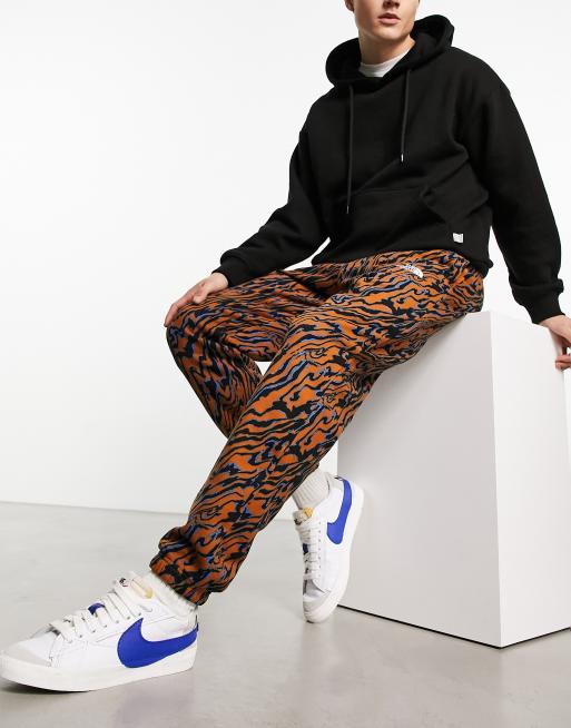 The North Face Essential oversized joggers in brown marble print Exclusive  at ASOS