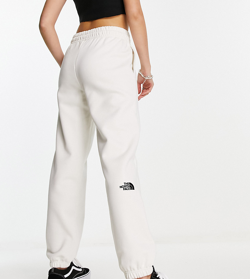 The North Face Essential oversized joggers in cream Exclusive at ASOS-White