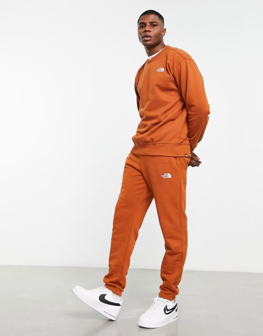 The North Face Essential sweatshirt in orange Exclusive at ASOS