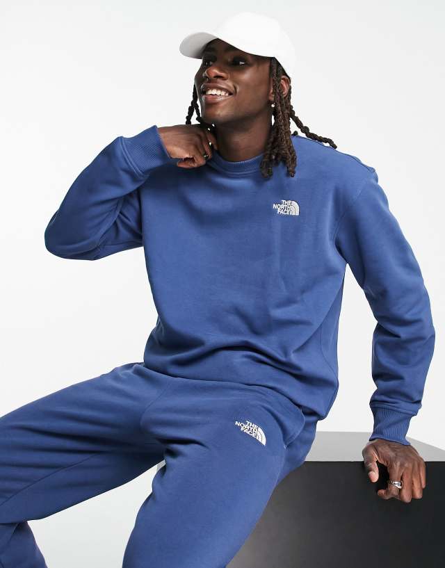 The North Face Essentials sweatshirt in dark blue - Exclusive at ASOS