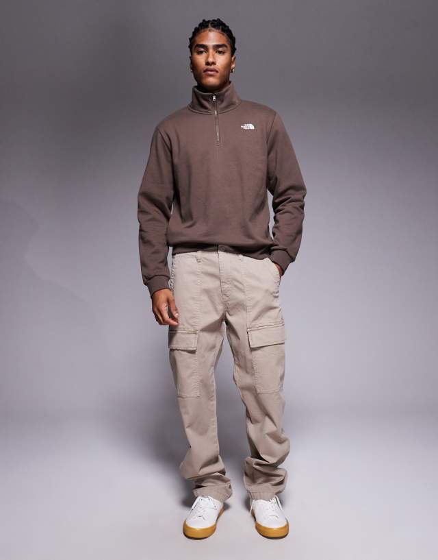 The North Face Evolution quarter zip sweatshirt in brown | ASOS