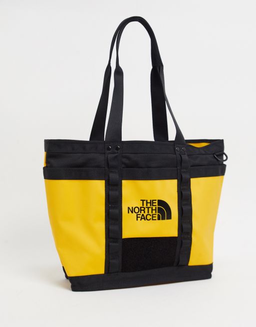 The North Face Explore Utility tote bag in yellow | ASOS