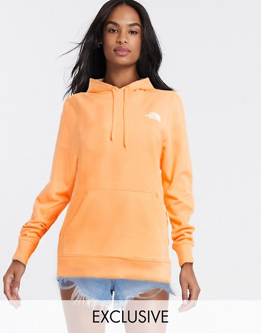 The North Face Faces hoodie in orange Exclusive at ASOS