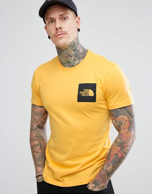 The north shop face yellow shirt