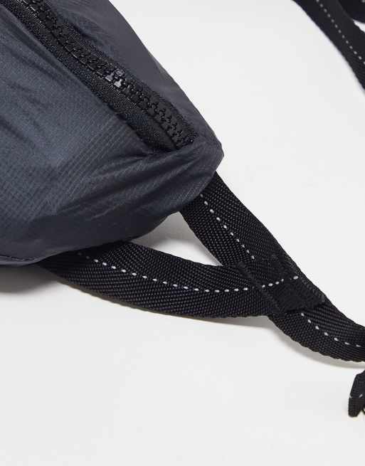 The North Face Flyweight Lumbar ripstop cross body bag in black, 3 of 4