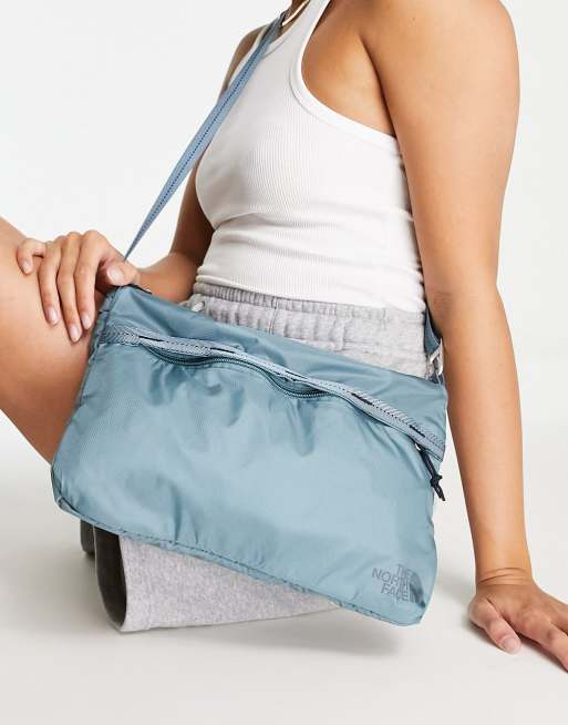 The North Face Flyweight shoulder bag in blue ASOS