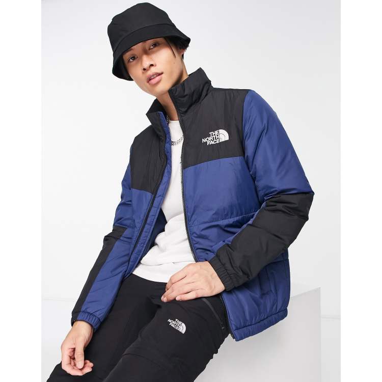 North face blue shop and black puffer jacket