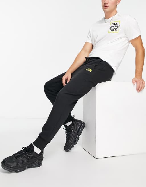 The North Face Graphic track pants in black - BLACK