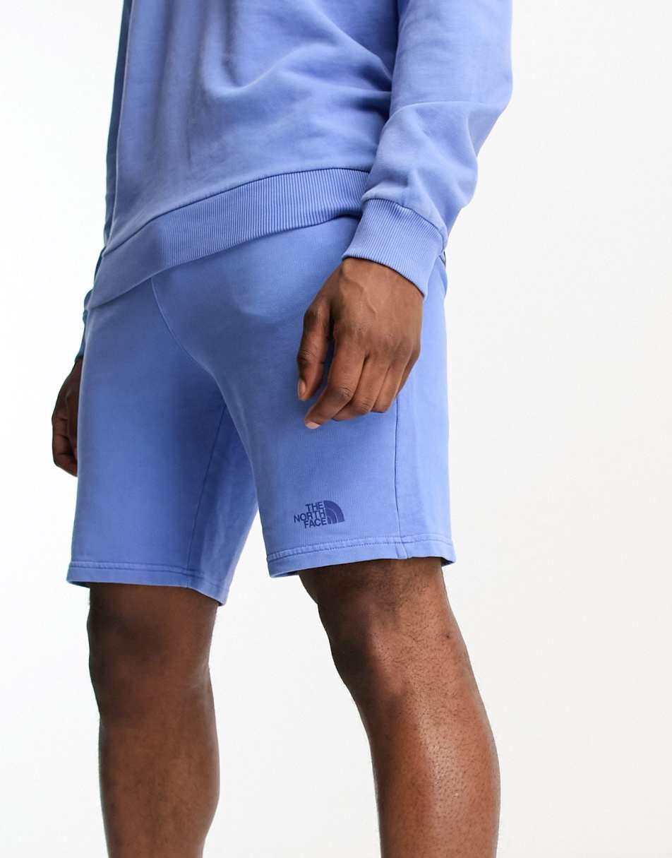 The North Face Heritage garment dyed fleece shorts in blue