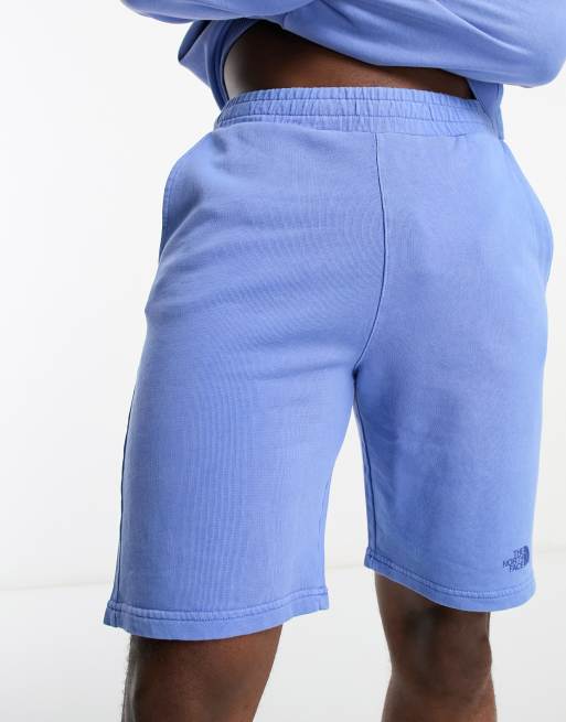 The North Face Heritage garment dyed fleece shorts in blue