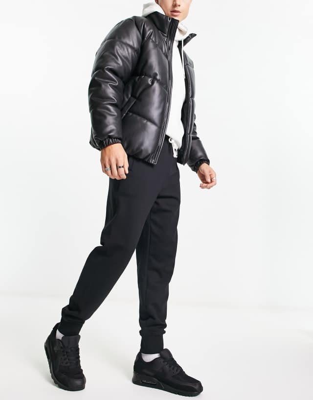 The North Face Heritage Patch sweatpants in black 0