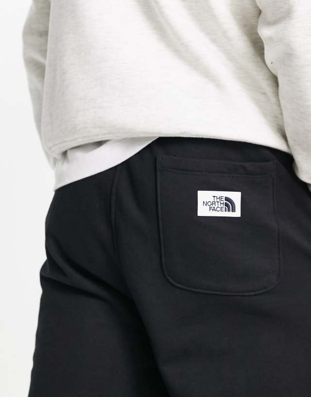 The North Face Heritage Patch sweatpants in black 1