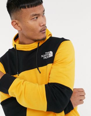 black and yellow north face hoodie