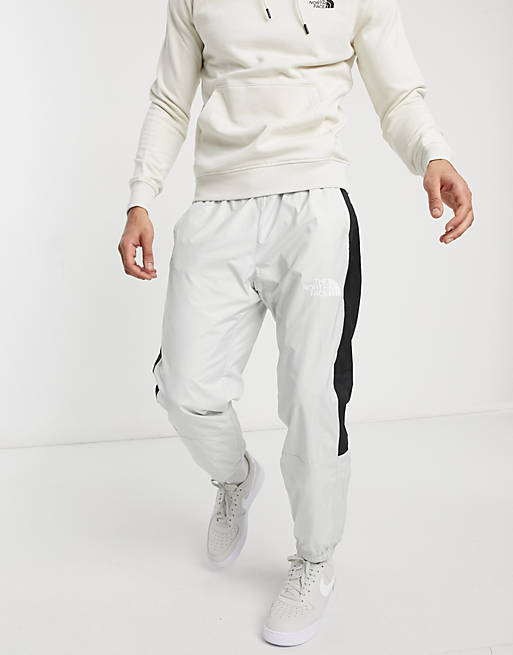 The North Face Hydrenaline wind trackies in light grey | ASOS