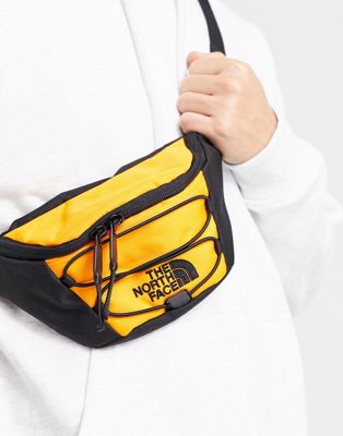 The North Face Jester bum bag in orange and black
