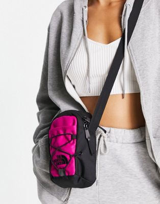 The North Face Jester cross body bag in pink and black
