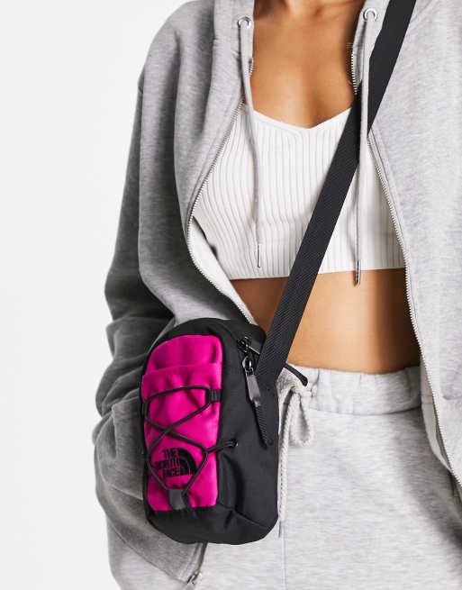 The North Face Jester cross body bag in pink and black | ASOS