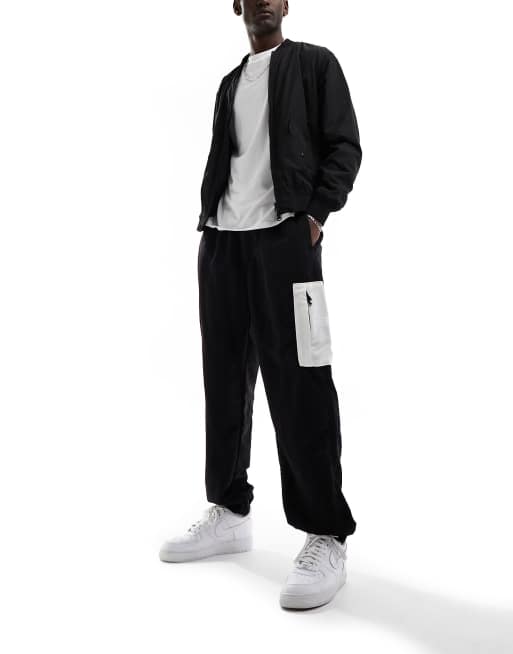 The North Face – Jogginghose aus gewebtem Nylon mit lockerem Schnitt in Schwarz und Weiß