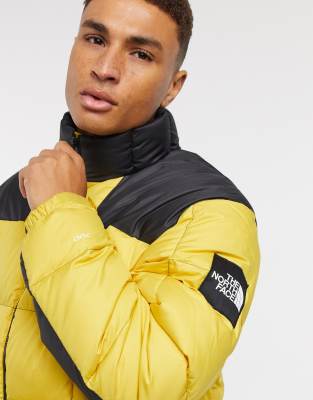 yellow and black north face puffer