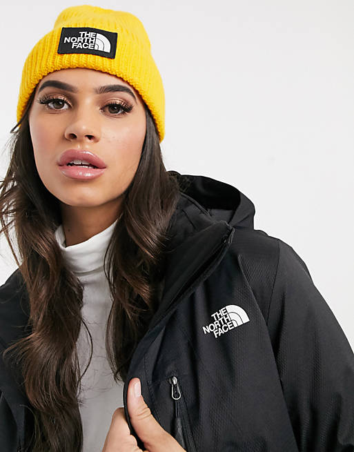 The North Face Logo box cuffed beanie in yellow | ASOS