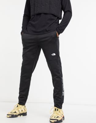 the north face train n logo track pants white