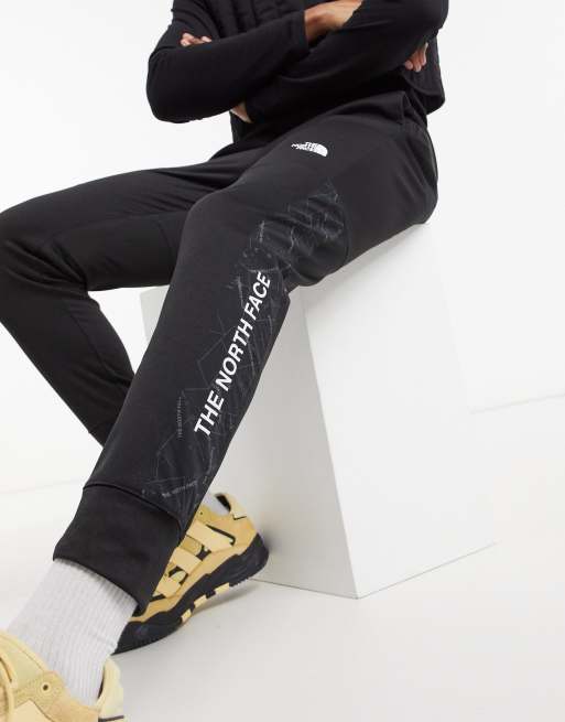 The North Face Mountain Athletic cuffed joggers in black ASOS