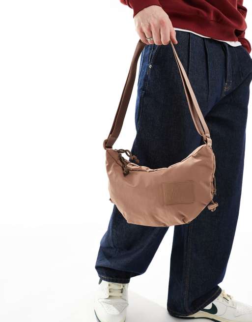 The North Face Never Stop cross body bag in brown | ASOS