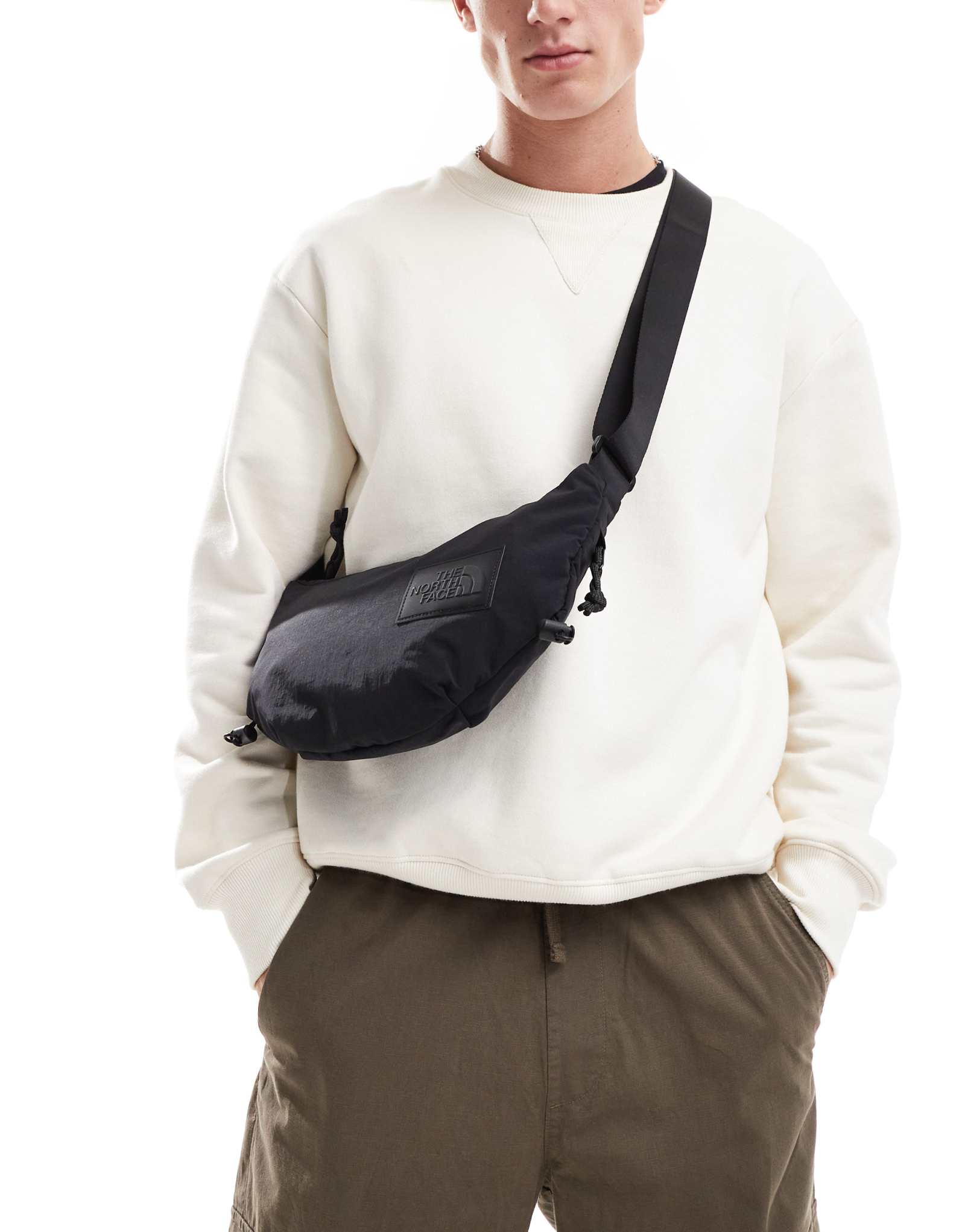 Сумка-слинг The North Face Never Stop черного цвета