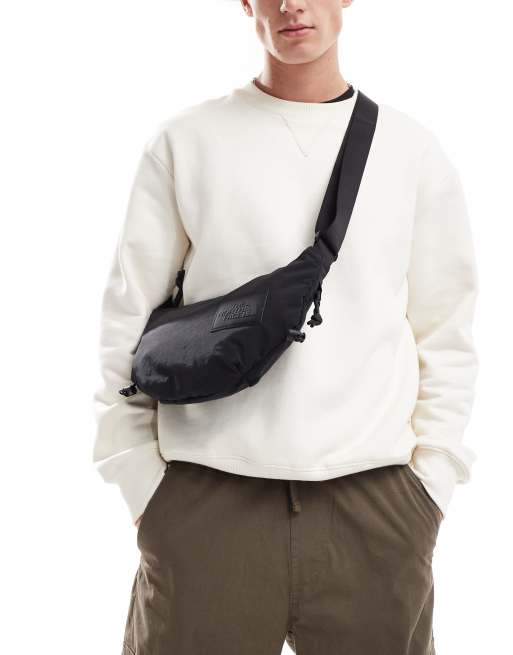 The North Face Never Stop sling cross body bag in black ASOS