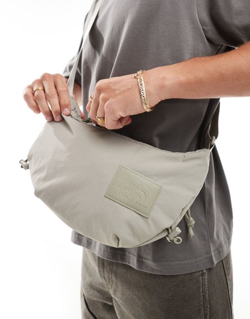 The North Face Never Stop sling cross body bag in clay gray