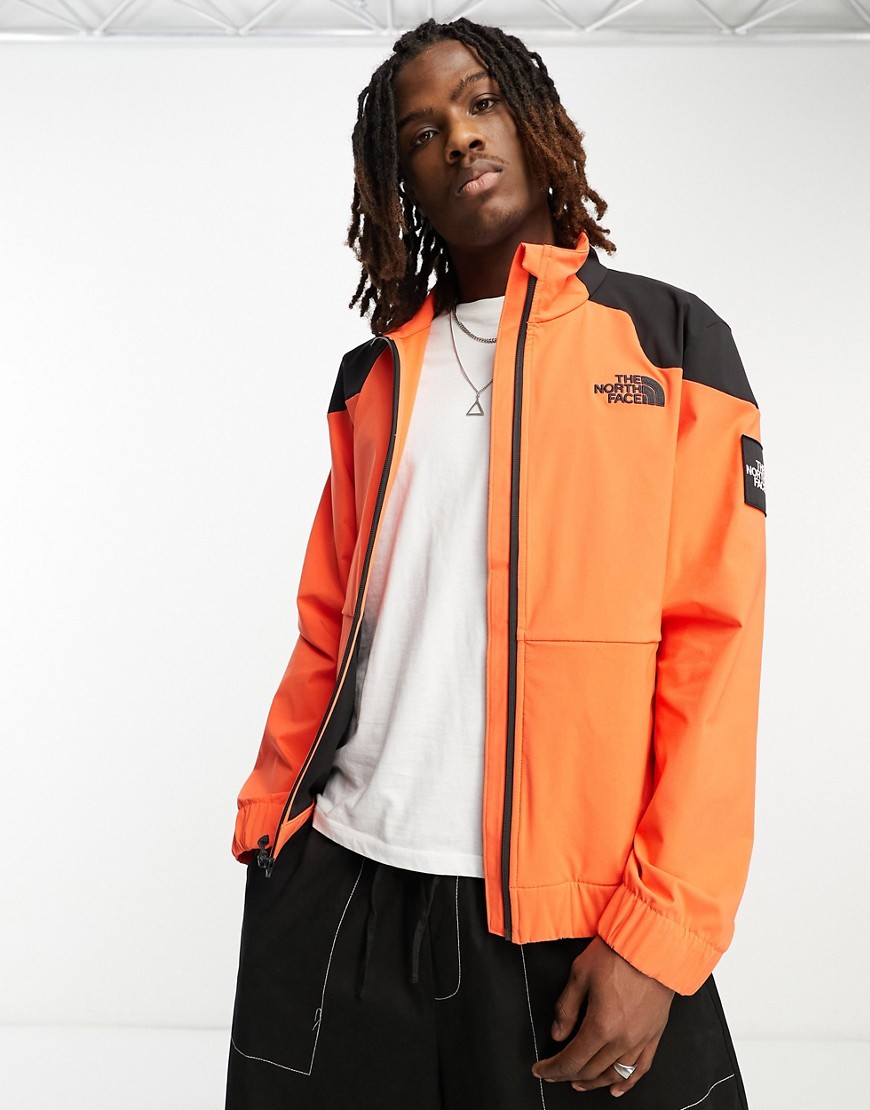 The North Face NSE Carduelis zip up softshell track jacket in orange and black