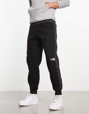 The North Face Woven joggers in black Compare Closer