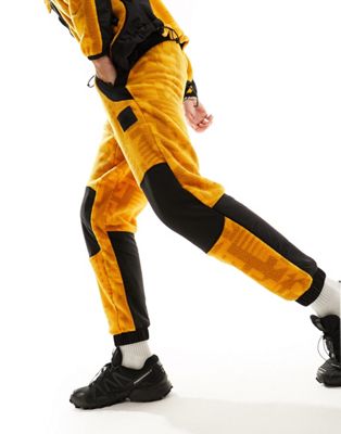 The North Face NSE Fleeski Y2K fleece joggers in yellow digi print - ASOS Price Checker