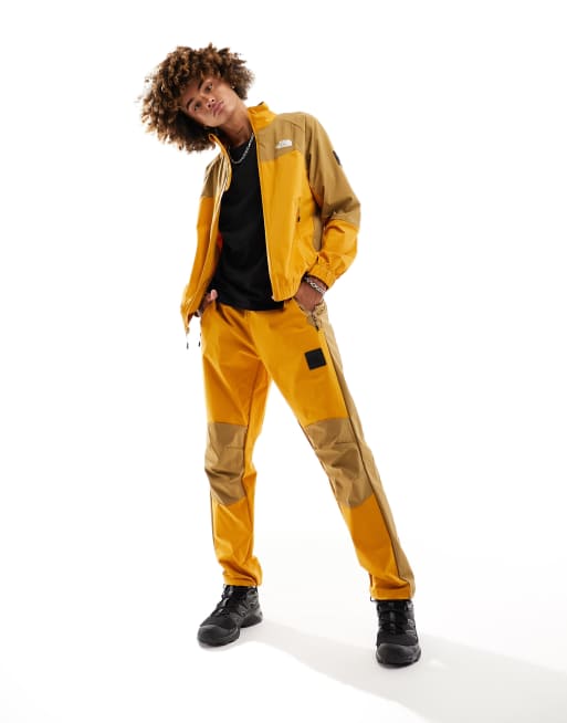 The North Face - NSE - Geweven shell-joggingbroek in geel en bruin