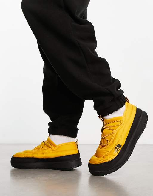 The North Face NSE insulated slip on shoes in yellow