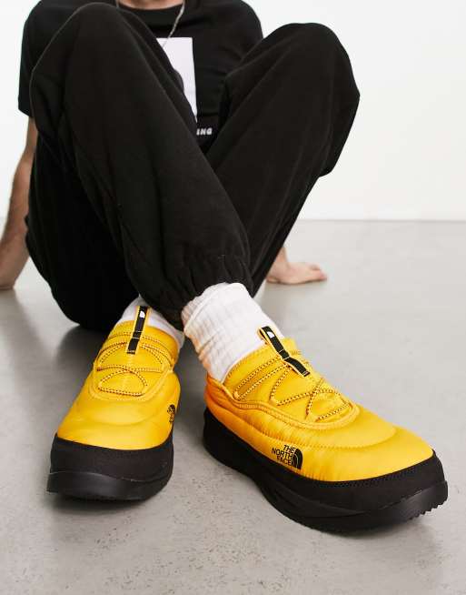 The North Face NSE insulated slip on shoes in yellow ASOS