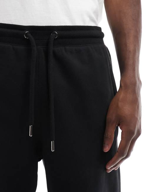 The North Face Tight sweatpants in black Exclusive at ASOS