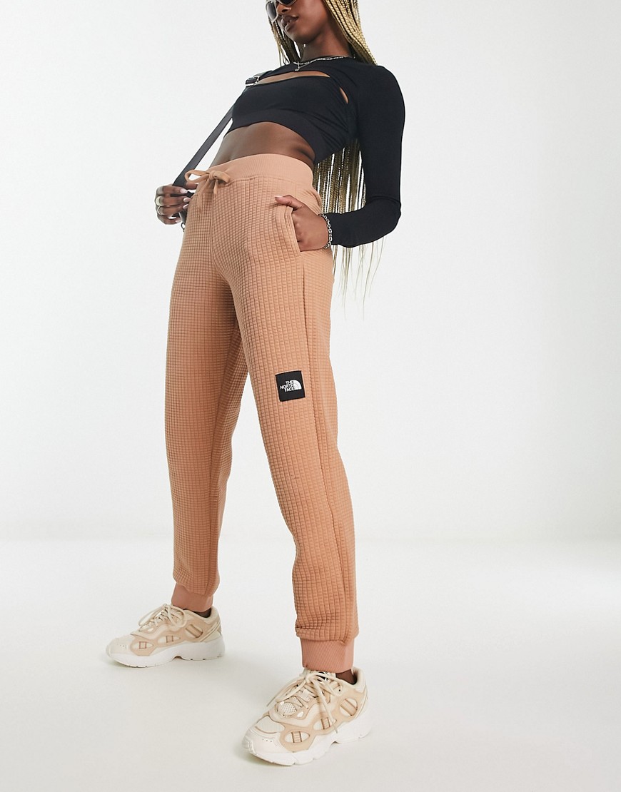 The North Face NSE Mhysa quilted joggers in brown