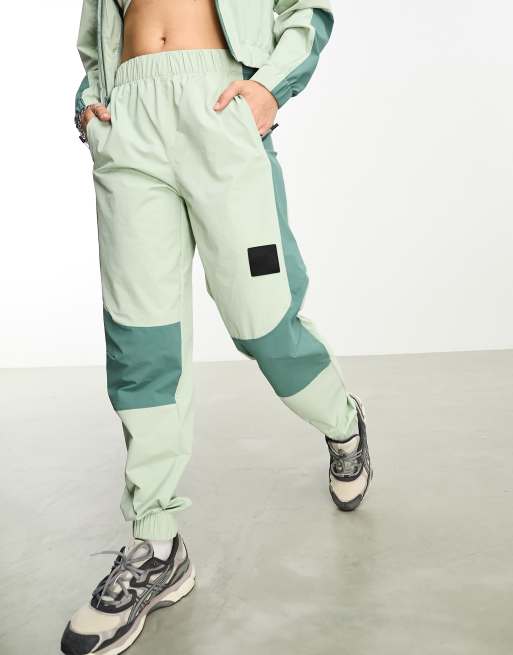 The North Face NSE Pantalon de jogging en tissu imperm able Vert sauge