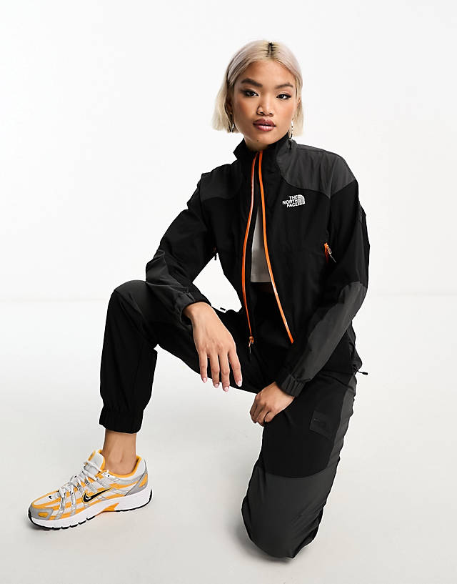 The North Face - nse shell suit track top in black and grey