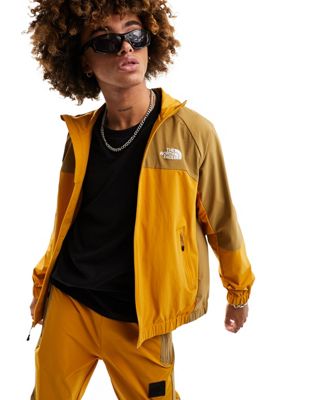 The North Face NSE shell track jacket in yellow and brown