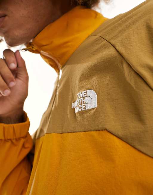 The North Face NSE shell track jacket in yellow and brown