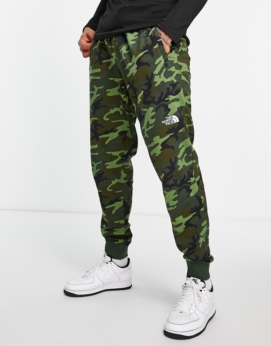 The North Face NSE sweatpants in camo-Green