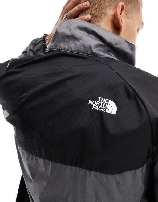 The North Face NSE Windshell zip tracktop in grey and black