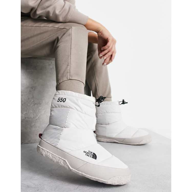 The North Face Nuptse Apres down insulated booties in cream ASOS