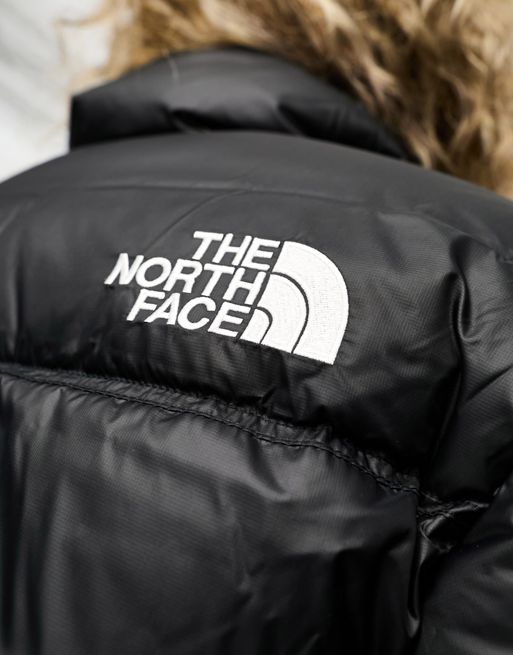 The North Face Phlego Synth cropped puffer jacket in black, ASOS