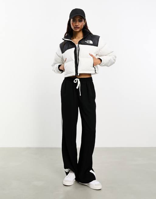 The North Face Phlego Synth cropped puffer jacket in black, ASOS