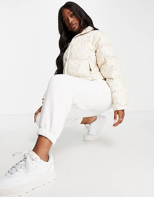 Women The North Face Nuptse cropped leopard printed jacket in white 