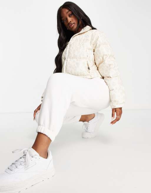 The North Face Nuptse cropped leopard printed jacket in white ASOS